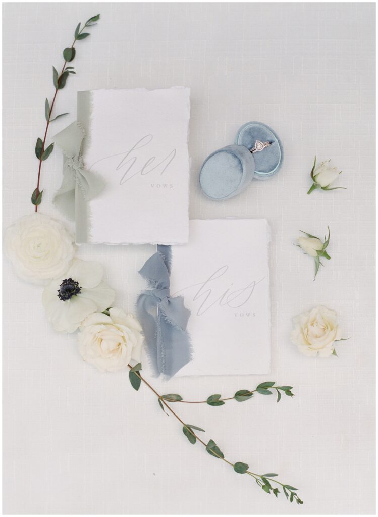 wedding vow book flat lay with flowers